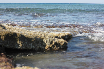 Alanya, TURKEY - August 10, 2013: Travel to Turkey. Beaches on the sea. Waves on the Mediterranean coast.