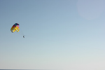 Alanya, TURKEY - August 10, 2013: Travel to Turkey. Parasailing. Active type of recreation at the sea. Parachute flights behind a boat.
