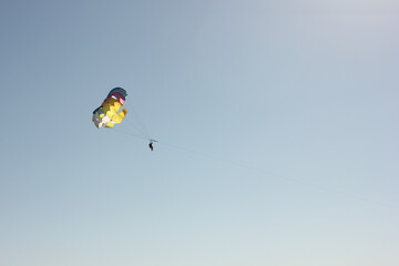 Alanya, TURKEY - August 10, 2013: Travel to Turkey. Parasailing. Active type of recreation at the sea. Parachute flights behind a boat.