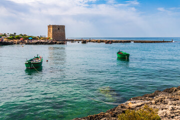 Fototapeta premium Monastery and boats frame the bay of San Vito. Polignano a mare