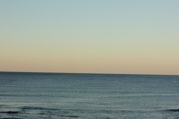 Alanya, TURKEY - August 10, 2013: Travel to Turkey. Sunset at the sea. Clean water surface. Small waves.
