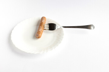 on a white background, a sausage stands in the bowl
