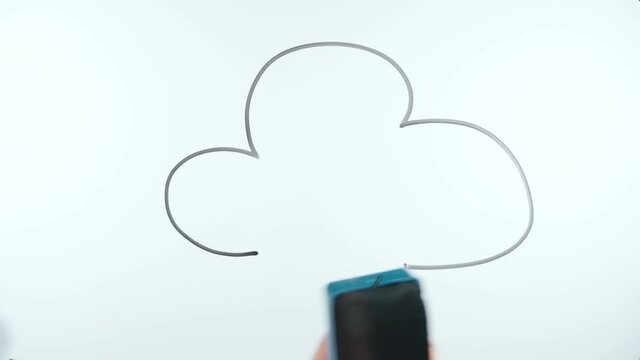 Shooting of man drawing cloud storage sign