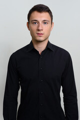 Obraz premium Portrait of handsome businessman against white background
