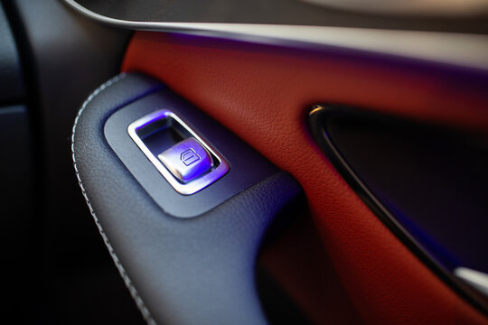 Mirror control knob in a modern car. Auto window button control inside driver place.