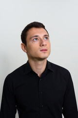 Portrait of handsome businessman against white background