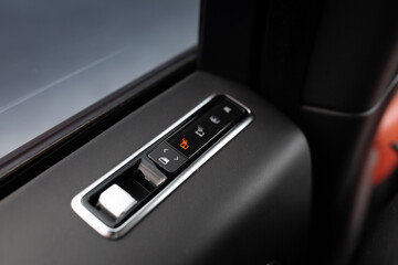 Automatic window button control inside luxury car driver place