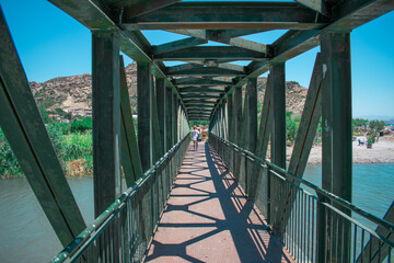 a metal bridge above the river, Crete, Greece