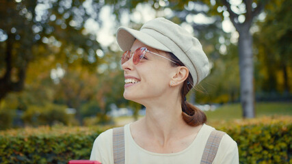 Smiling girl in a park in Paris