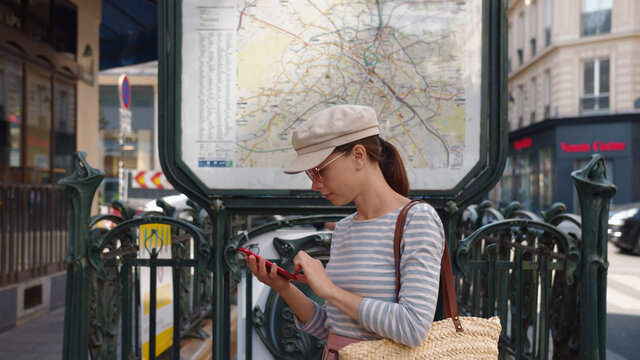 Young tourist with a phone in Paris