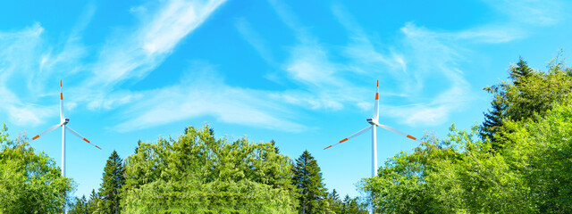 Wind power background banner wide panoramic panorama - Blue cloudy sky with many windmill / wind...