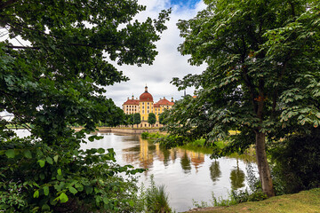 Fototapeta premium Baroque castle Moritzburg, view through trees, Moritzburg, near Dresden, Saxony, Germany.