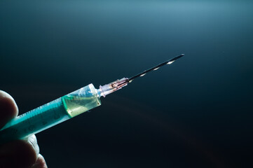 Syringe in hand