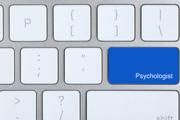 Modern computer keyboard with word PSYCHOLOGIST, top view
