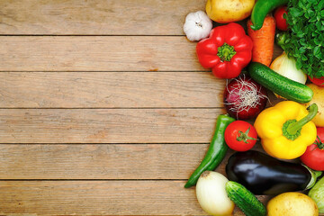 set of fresh vegetables on a wooden background copyspace