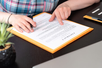 Fototapeta premium Female lawyer checking contract