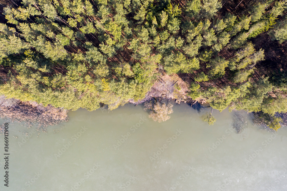 Wall mural Drone shot top down view on spring lake