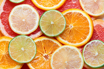 Beautiful fresh sliced mixed citrus fruits like background. Concept of healthy eating, detox, diet....