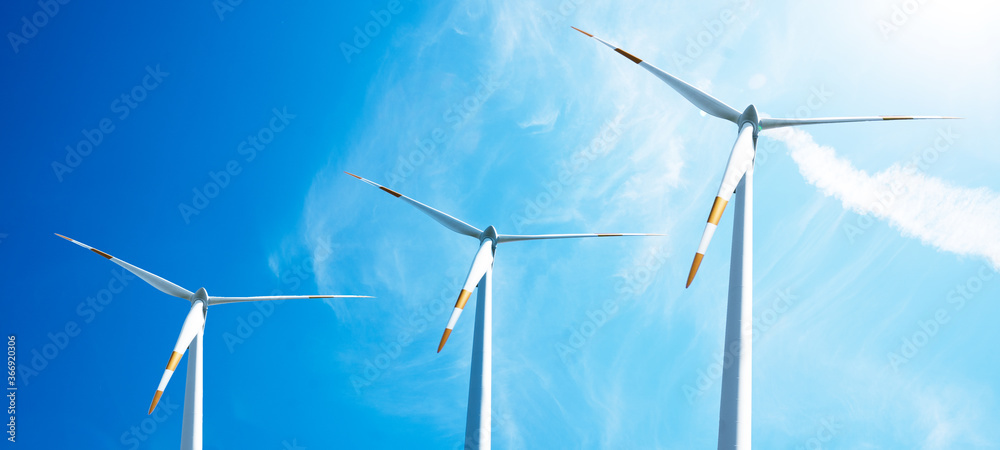 Wall mural wind power background banner wide panoramic panorama - blue cloudy sky with many windmill / wind tur