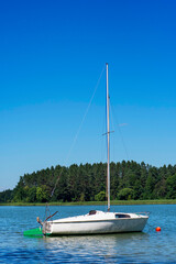 Fototapeta na wymiar Vacation in Poland - sailboat on lake, Masuria 