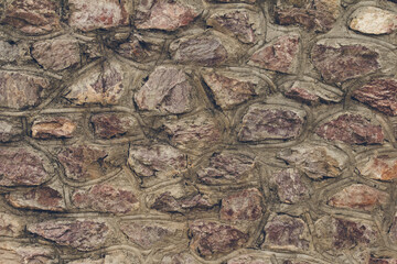 Stone blocks wall textured background. Close up, toned
