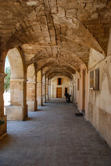 Fototapeta na wymiar Mediterranean rural dwelling, enfalada with arches and patio, terrace with limestone columns.