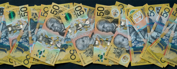 Australian fifty dollar notes with clear security strip, banner
