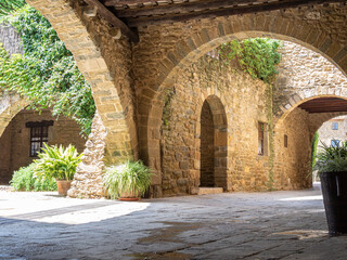 Fototapeta na wymiar Carrer dels Arcs street (Street of Arches) in Monells village in Catalonia, Spain