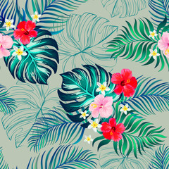 Tropical floral seamless pattern with exotic palm leaves. Trendy summer print with hibiscus  flowers.