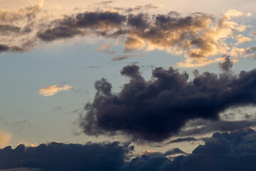 Fototapeta na wymiar Dark clouds. Blue sky. Beautiful natural background.