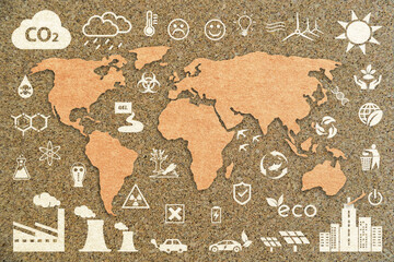 Brown paper World Map on cork backdrop with ecology icons. Ecology concept background.