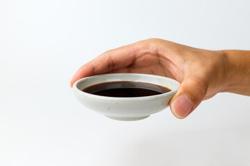 Soy sauce on a white background