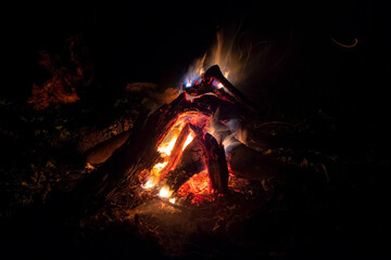 Beautiful closeup of fireplace with red coal and fire at night. Closeup of bonfire or fireplace at...