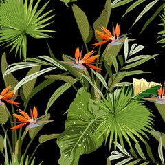 Illustration with orange strelitzia exotic flowers. Beautiful seamless background with tropical plants on black. Composition with flowers and exotic palm leaves.
