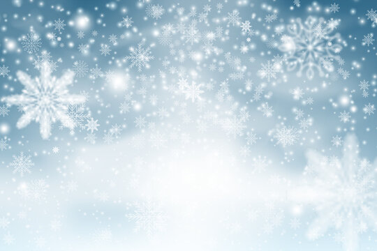 Winter blue sky with falling snow, snowflake. Christmas snow surface. Christmas Snowflakes Shining