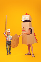 little knight and  cardboard dragon