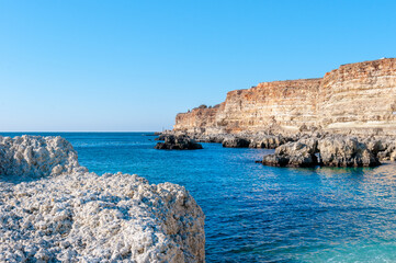 Fototapeta premium Beautiful black sea landscapes on South of Russia. Orange mountains an many birds on beach rocks