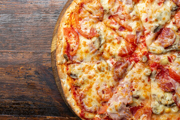 Delicious, freshly baked pizza. Fast food delivery. Bad but tasty food. Space for text or copy space. Restaurant menu advertise.