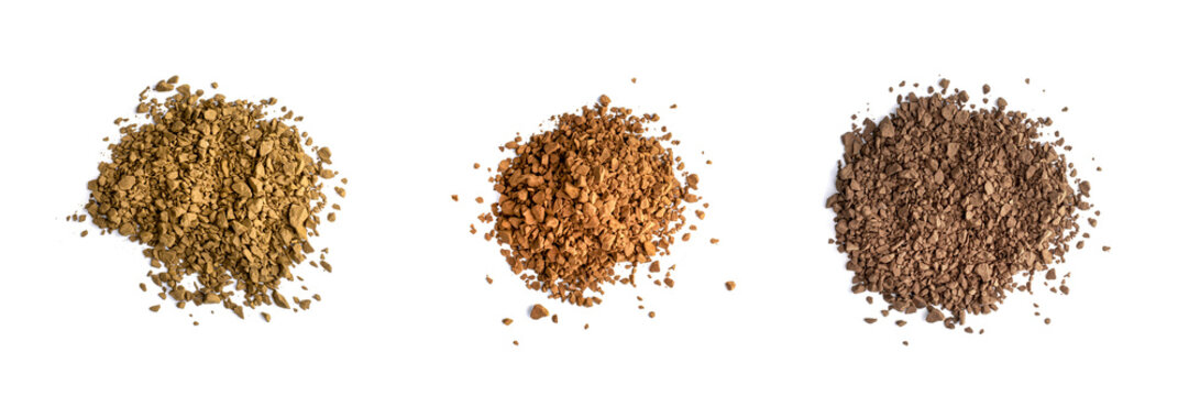 Color various of instant coffee. Granules heap isolated on white, top view