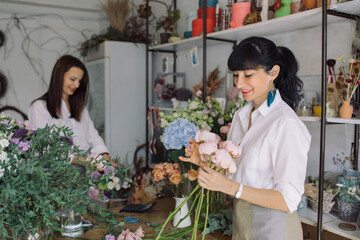 Florists at work. Small floral business owner. Female power startup concept.