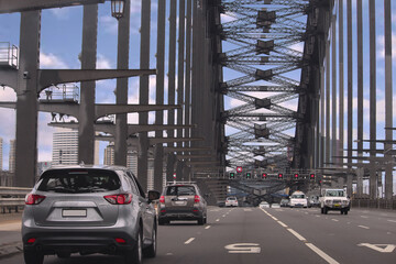 Driving across the Sydney Harbour Bridge heading south to the city - Powered by Adobe