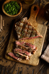 Roasted beef steak on a wooden desk