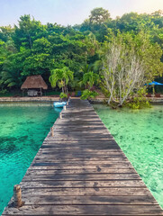 Bacalar, Quintana Roo / Mexico - August 23, 2018: Wooden pier in a resort at Bacalar Lagoon