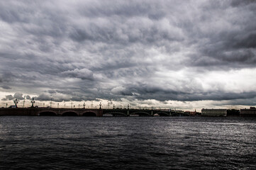 Storm clouds over the river, bridge over river