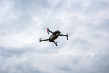Drone hoovering outdoors during evening and blue hour. Photo and video concept.