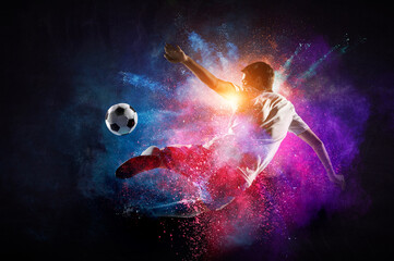 Boy playing soccer hitting the ball