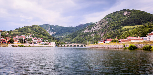 Fototapeta na wymiar Historic bridge over the Drina River, Panoramic view of Famous Tourist Attraction, Visegrad, Bosnia and Herzegovina