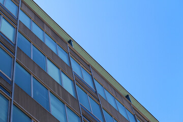 Abstract close up of a Mid-century vintage office building with a blue sky