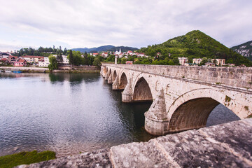 Fototapeta premium Historic bridge over the Drina River, Famous Tourist Attraction, The Mehmed Pasa Sokolovic Bridge in Visegrad, Bosnia and Herzegovina