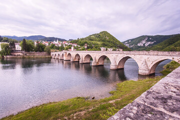 Fototapeta premium Historic bridge over the Drina River, Famous Tourist Attraction, The Mehmed Pasa Sokolovic Bridge in Visegrad, Bosnia and Herzegovina